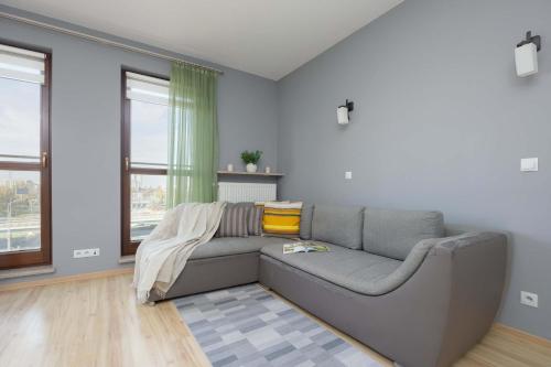 Grey Apartment in Warsaw with City View and Balcony by Noclegi Renters