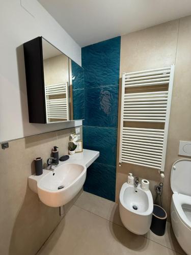 a bathroom with a sink and a toilet at Maggiore Panoramic Tower in Castel Maggiore