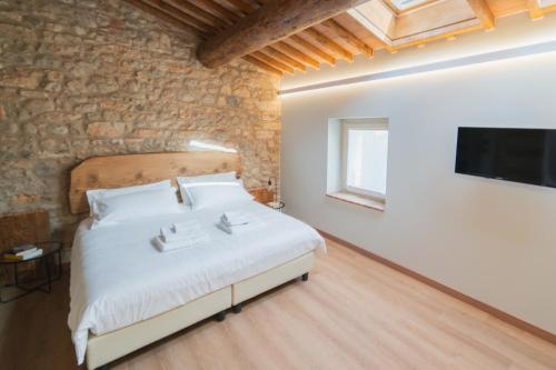 Postel nebo postele na pokoji v ubytování Corte Bonfiglio Colombari