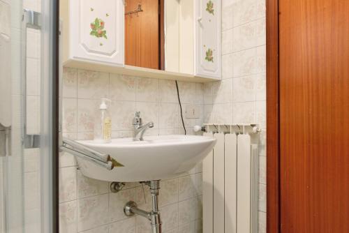 a bathroom with a sink and a mirror at La piccola Lami in Intra