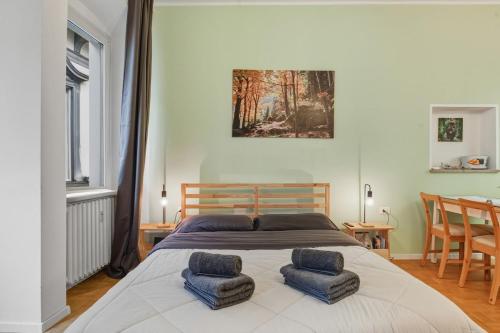 En eller flere senge i et værelse på Lauben Apartment II Bolzano