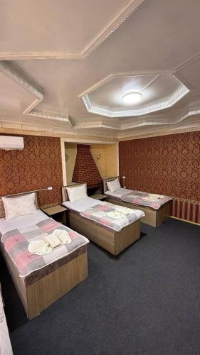 Ένα ή περισσότερα κρεβάτια σε δωμάτιο στο Aqso Hotel