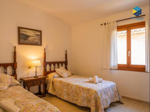 Postel nebo postele na pokoji v ubytování Can Guillem