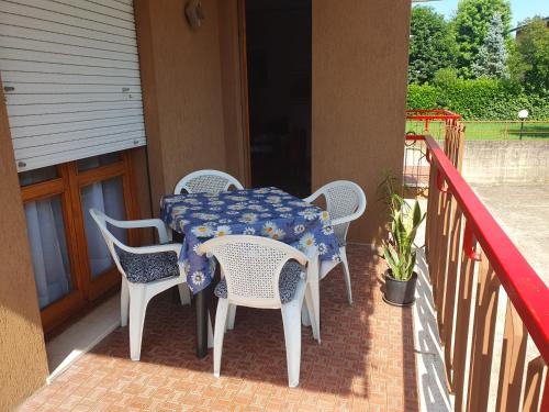 a table and chairs on the porch of a house at Casa Antonietta in Treviso