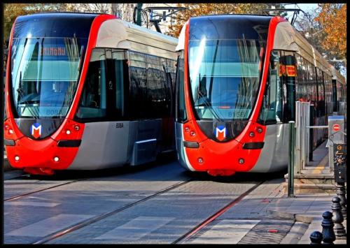 two red and white trains parked next to each other at Hotel Empress Zoe in Istanbul