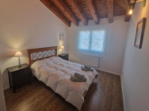 a bedroom with a large bed and a window at Las Natillas Con V - Martín Miguel in Martín Miguel