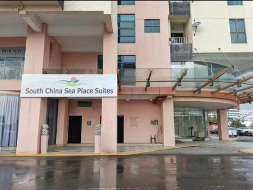 a south china sea plate suites sign in front of a building at GR Ming garden SCSP in Kota Kinabalu