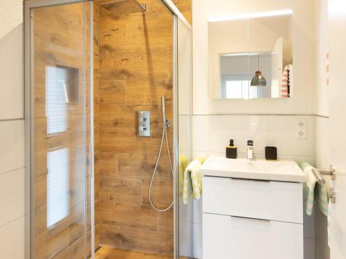 a bathroom with a shower and a sink at Ferienwohnung Verschnuufeckli in Wehr
