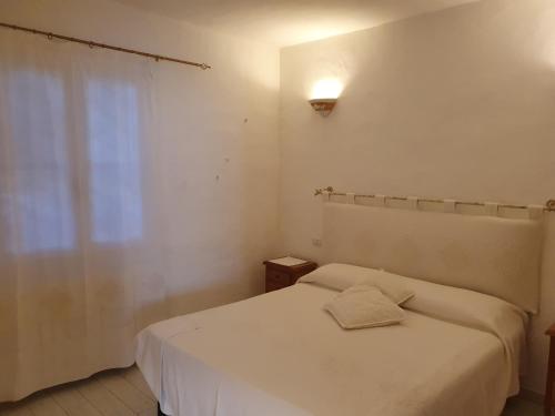 Postel nebo postele na pokoji v ubytování Casa vacanza in riva al mare