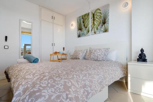 a bedroom with a bed and a table at Salou apartment beach in Salou