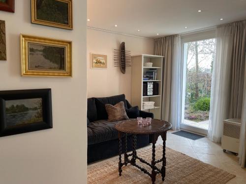 a living room with a couch and a table at Strandgut in Rostock