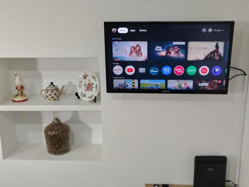 a tablet is on a shelf in a room at Apartment in Semeador in Portalegre