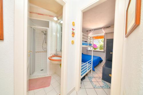 a small bathroom with a bunk bed and a toilet at Villa Bianca Un angolo di paradiso in Ischia