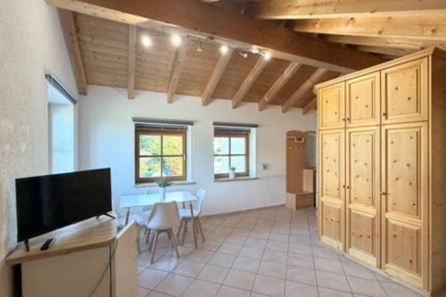 a large living room with a table and a tv at NEU! Ferienwohnung Durach in Durach