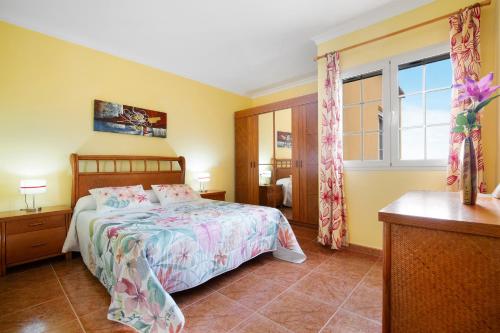 a bedroom with a bed and a window at Casa Paco 2 in Costa Calma