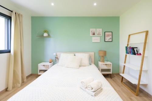 Postel nebo postele na pokoji v ubytování Villa Iguski