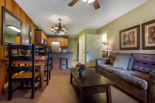 a living room with a couch and a table at Bluegreen Vacations Blue Ridge Village, an Ascend Collection Resort in Banner Elk