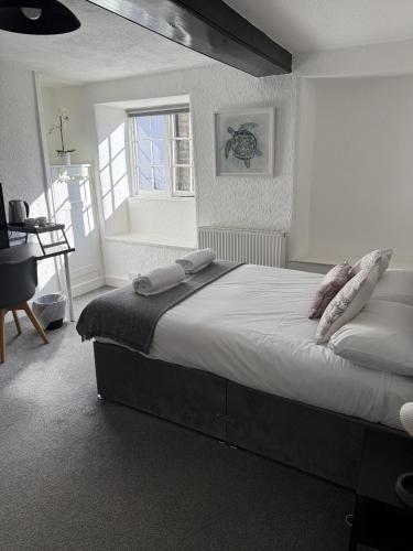 Postel nebo postele na pokoji v ubytování Britannia inn