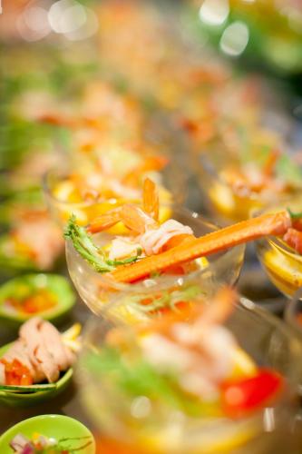 a bunch of salad dishes on a buffet at Sanding New Century Grand Hotel Yiwu in Yiwu
