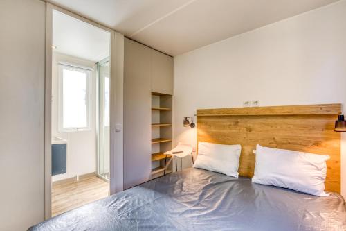 Postel nebo postele na pokoji v ubytování Mobilhome 6 pers au Castellas