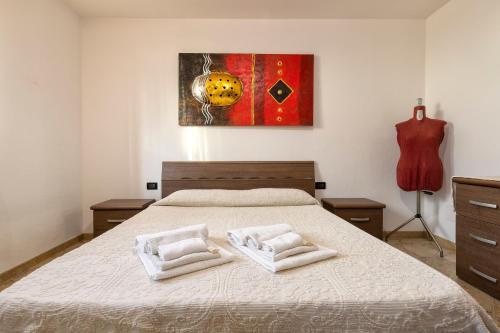 Giường trong phòng chung tại Casa Vacanze vicino ad alghero