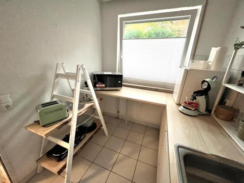 Kuchyň nebo kuchyňský kout v ubytování Kleine Oase am Mittellandkanal