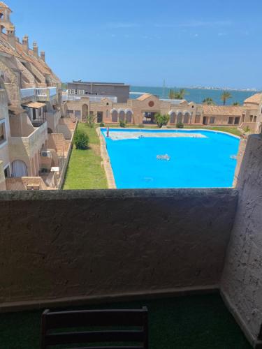 desde el balcón de una piscina en DUPLEX BAHIA SuR RESERVA DE CONFI-ANZA, en San Fernando