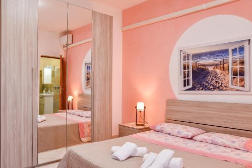 Ένα ή περισσότερα κρεβάτια σε δωμάτιο στο Villa Nicolai - Primo Piano