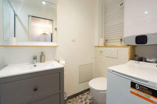 a small bathroom with a sink and a toilet at Chalet Belamy Studio 1 in Courchevel