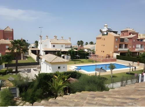 a view of a villa with a swimming pool at Villa con Piscina climatizada in Sanlúcar de Barrameda