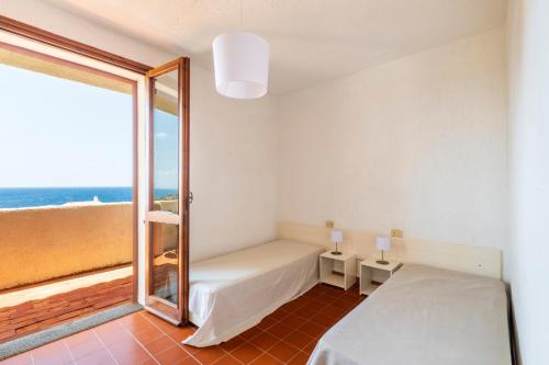 Postel nebo postele na pokoji v ubytování Residence Baia Santa Reparata