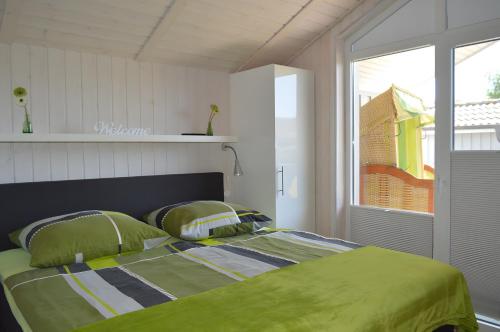 Postel nebo postele na pokoji v ubytování Ferienhaus Nordseeluft