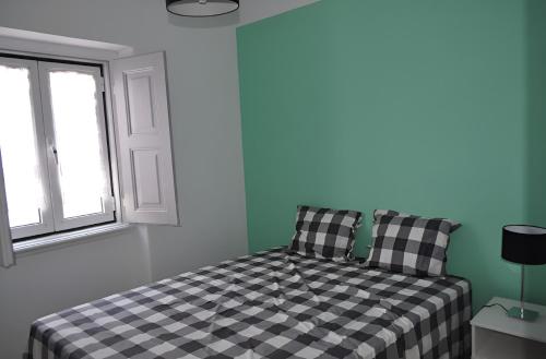 Ένα ή περισσότερα κρεβάτια σε δωμάτιο στο Casa do Mestre By Gt House