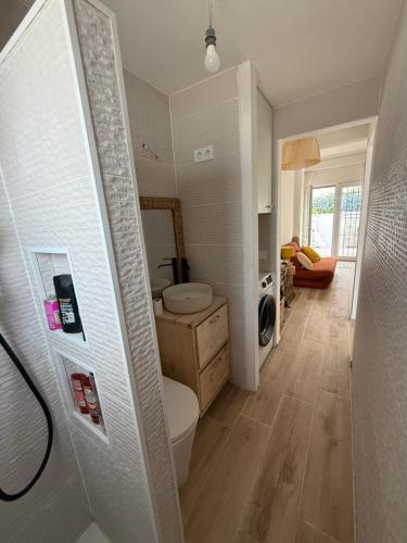 a bathroom with a toilet and a sink at Casa Eveline in Punta Prima