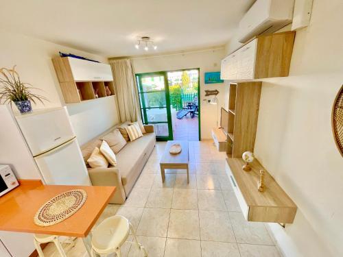 a living room with a couch and a table at Paradise Dreams in Maspalomas