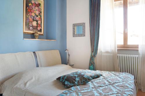 Postel nebo postele na pokoji v ubytování La Corte di Langa alloggio Turchese