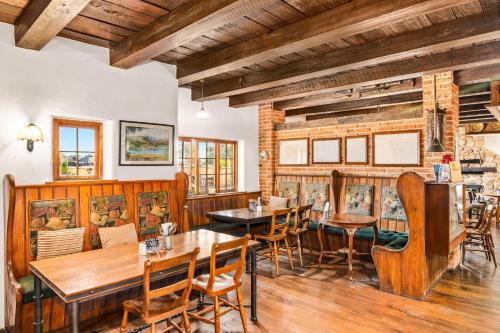 a dining room with wooden tables and chairs at The Honest Lawyer, an Ascend Collection Hotel in Nelson