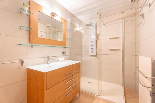a bathroom with a sink and a shower at Unique Patacona in Valencia