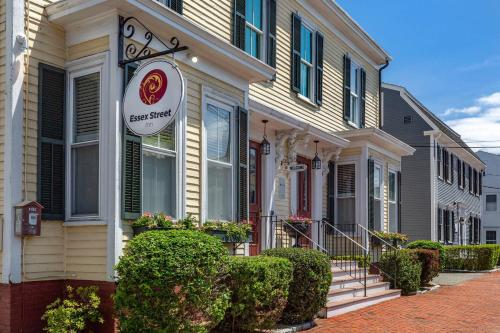 a house with a sign in front of it at Essex Street Inn & Suites, an Ascend Collection Hotel in Newburyport