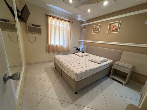 Cama o camas de una habitación en Flats Ponte Pênsil