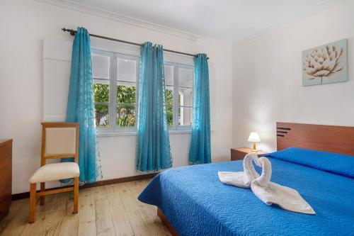 Postel nebo postele na pokoji v ubytování Bettencourt House