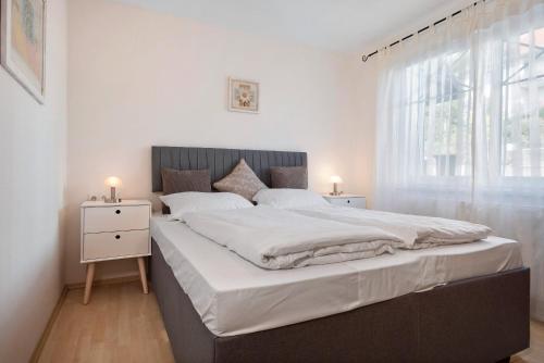 Postel nebo postele na pokoji v ubytování Haus Jacqueline