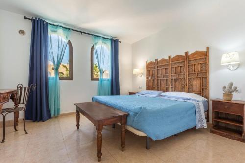 En eller flere senge i et værelse på Fuerteventura Apartments Harmony