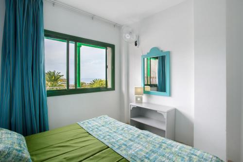 Giường trong phòng chung tại Casa Los Veleros F2