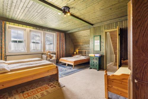 a bedroom with two beds in a room at Haus Sonnenberg in Willingen