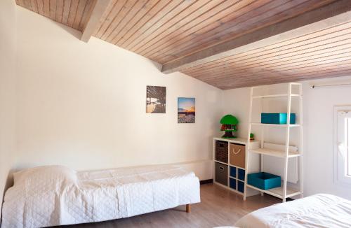 Postel nebo postele na pokoji v ubytování Maison Roxane