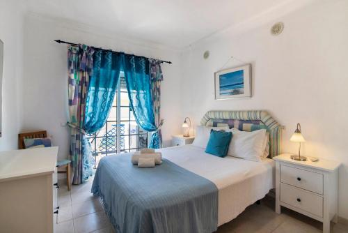 Ένα ή περισσότερα κρεβάτια σε δωμάτιο στο T2 Bosque de São José