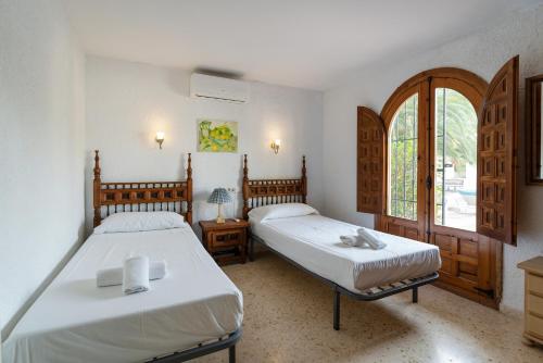 Postel nebo postele na pokoji v ubytování Rosa