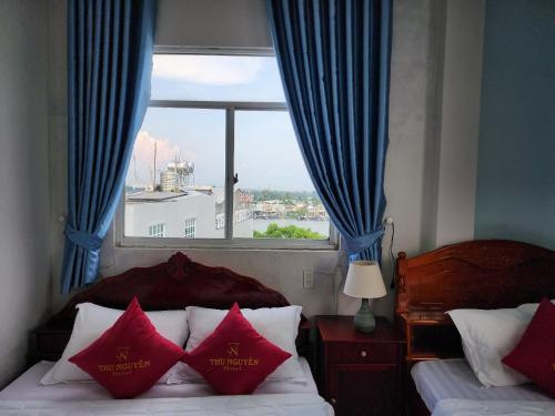 Krevet ili kreveti u jedinici u okviru objekta KHÁCH SẠN THU NGUYỄN - Ngay BẾN NINH KIỀU, CHỢ ĐÊM