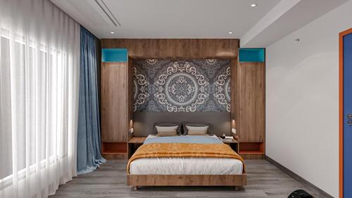 a bedroom with a bed and a large wall at Zone by The Park New Market Kolkata in Kolkata